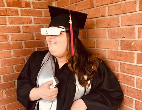 Drue Collins Pictured Using eSight. She was one of the CNIB scholarship winners